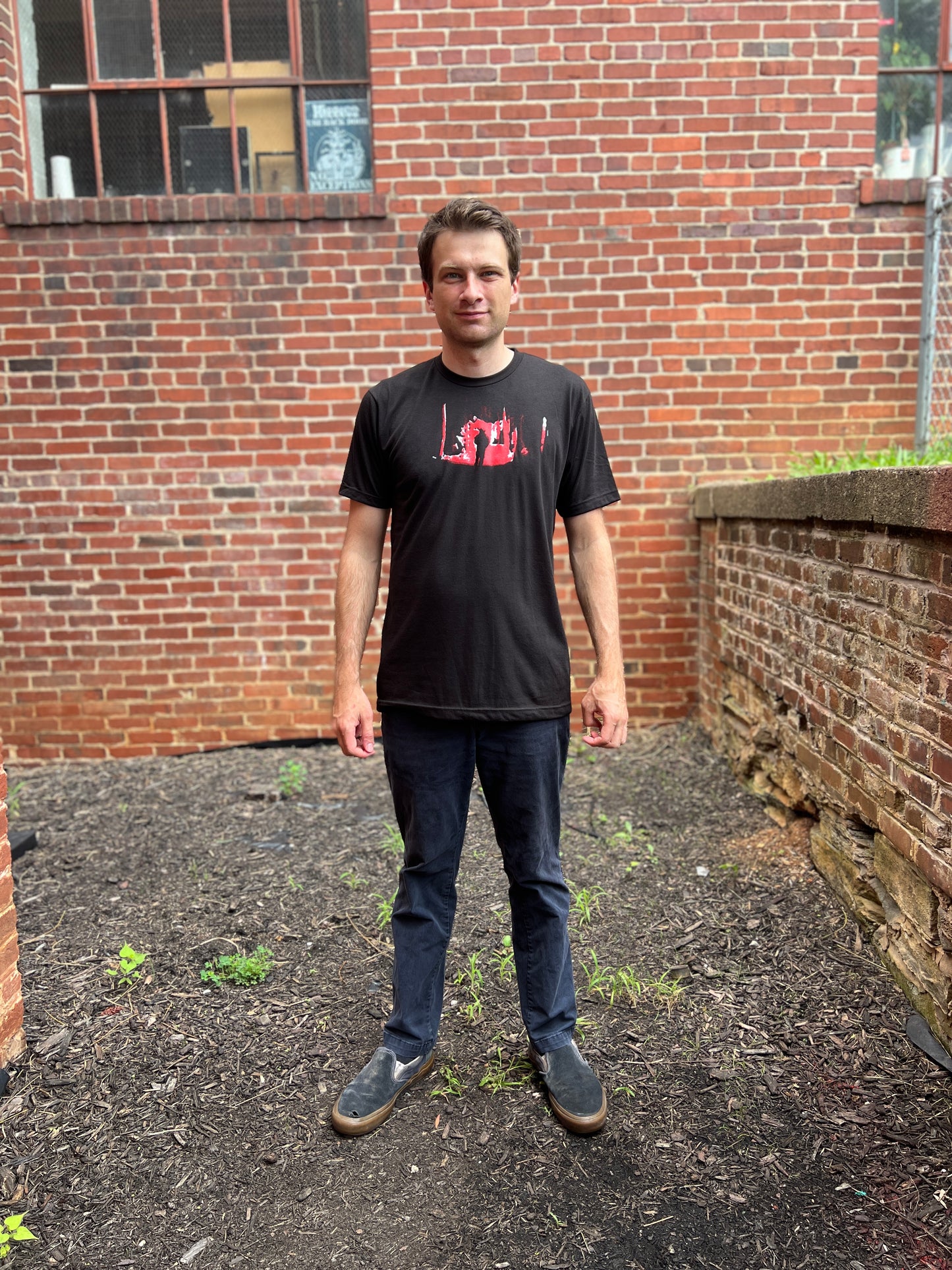 Guy in a woods tee